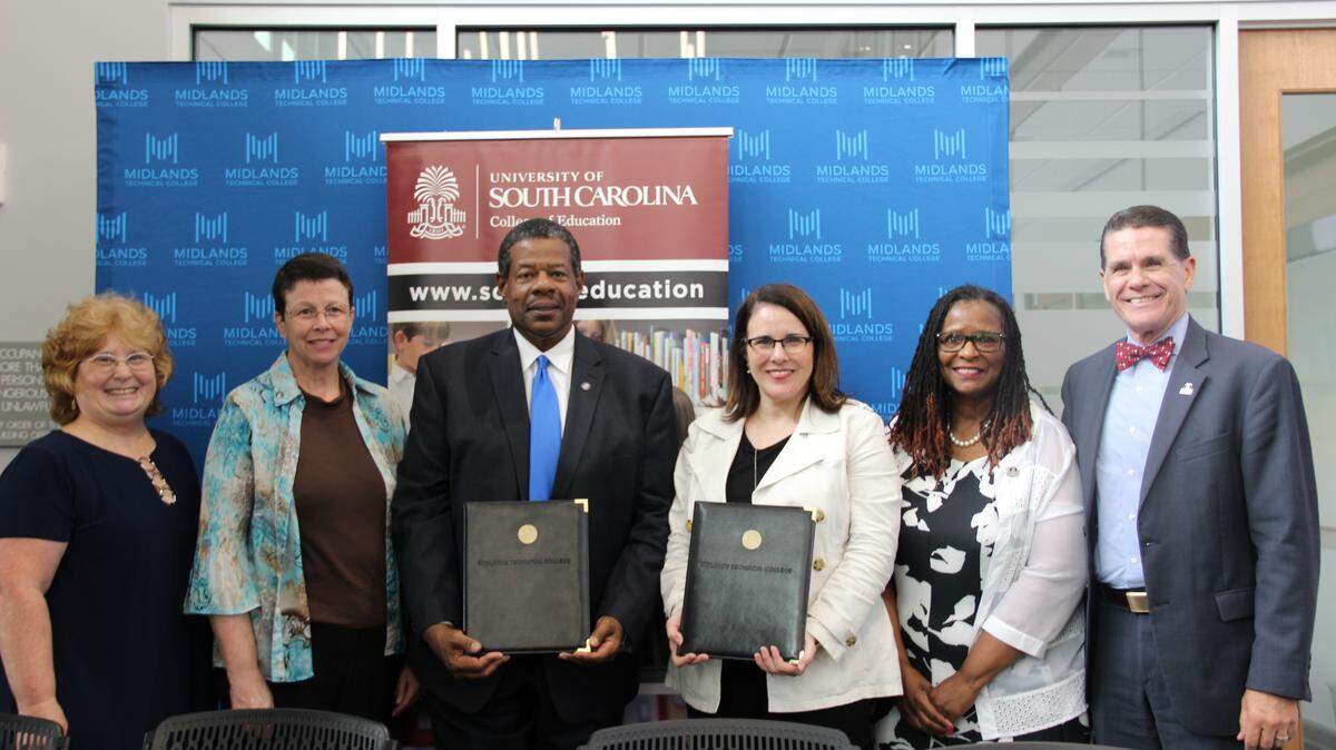 Administration from Midlands Technical College and the University of South Carolina pose for a picture during a June 6, 2018 press conference announcing a partnership aimed to reduce the cost of education for students studying to become teachers. Pictured from Left to right are: Sandra Hackley, Diane Carr, Ronald Rhames, Joan Gabel, Fenice Boyd and Jon Pedersen.