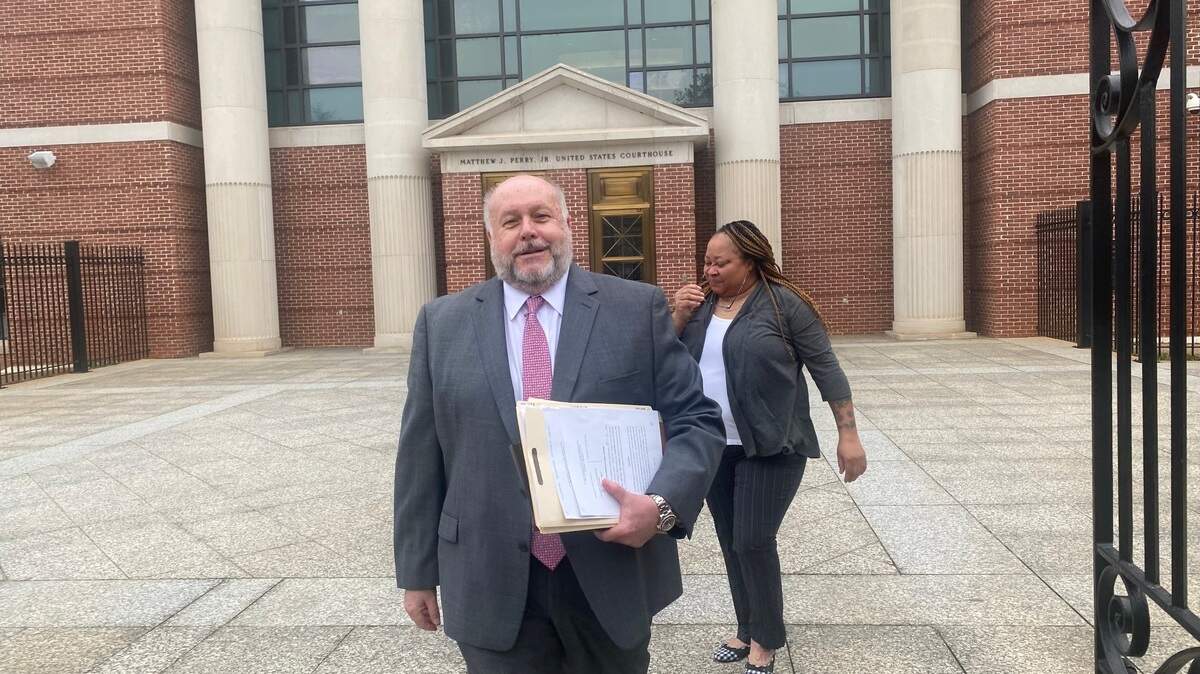 Ex-top state prison guard Christine Livingston (right) leaves federal courthouse Monday after pleading guilty to a federal fraud charge involving bribes and selling contraband to inmates. Her lawyer, Mark Moore, leaves with her.