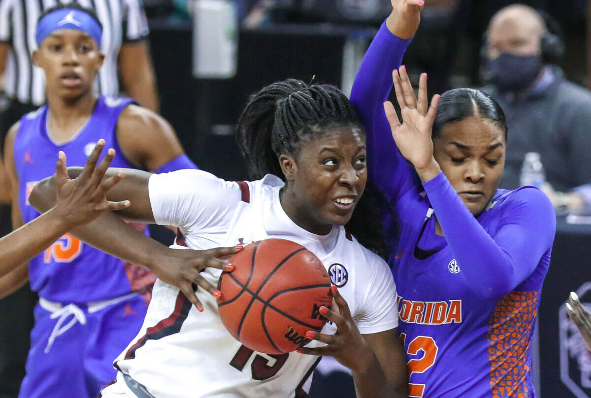 South Carolina Gamecocks forward Laeticia Amihere (15) drives into Florida forward Jordyn Merritt (12) during the first half of action in the Colonial Life Arena.