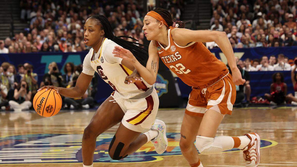 University of South Carolina’s Joyce Edwards (8) brings the ball downcourt as Texas’ Ndjakalenga Mwenentanda (32) pressures during the first half at Amalie Arena in Tampa, Fla. on Friday, April 4, 2025.