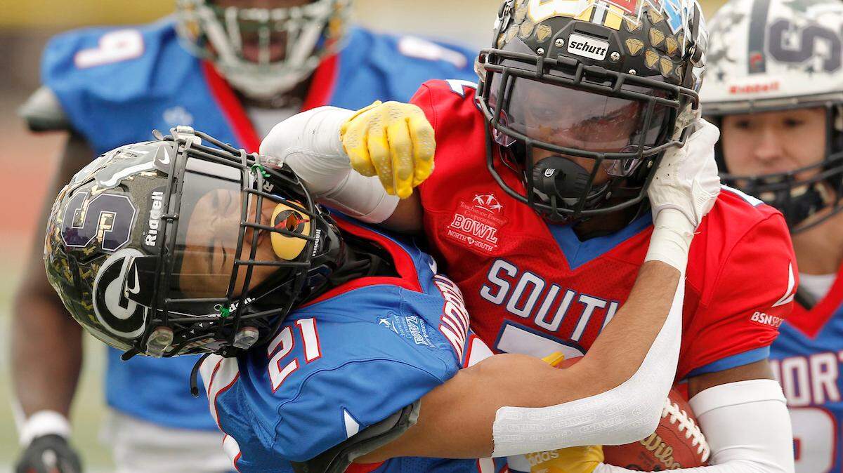 Gaffney High School’s Kaliber Hoey is knocked down by Lower Richland High School’s Nate Branch during first-half action of the Touchstone Energy Bowl in Myrtle Beach, S.C. on Saturday, Dec. 10, 2022.