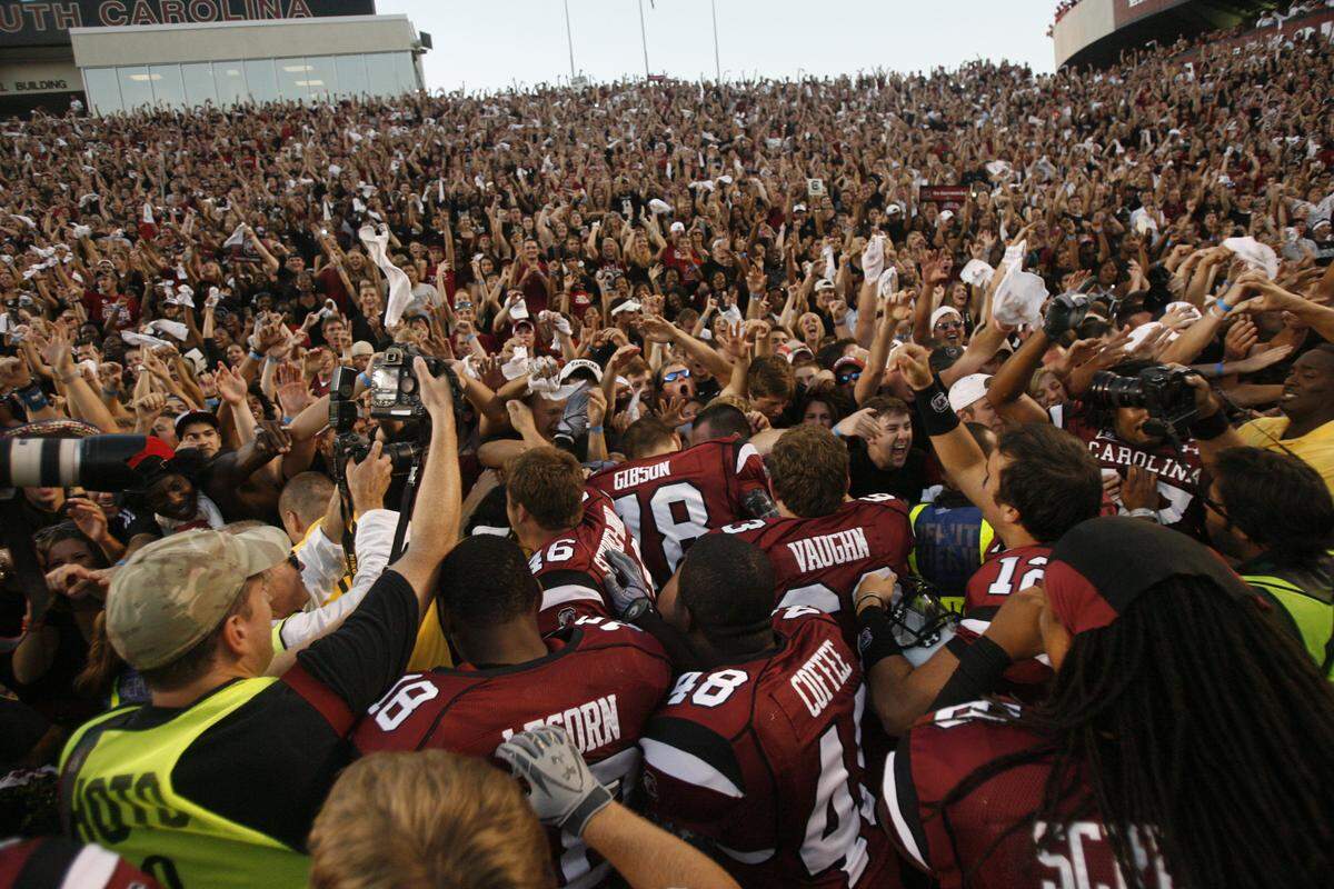 From Oct. 9, 2010: USC players celebrate with fans after their 35-21 win over Alabama at Williams-Brice Stadium.