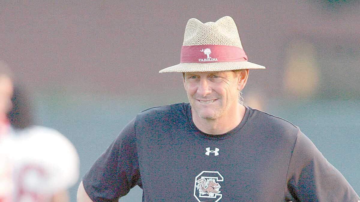USC offensive line coach John Hunt watches a blocking drill during the Gamecocks practice in this August file photograph. Hunt has been fired after offensive problems plagued the team this season.