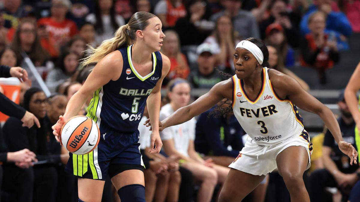 INDIANAPOLIS, INDIANA - APRIL 30: Paige Bueckers #5 of the Dallas Wings controls the ball against Raven Johnson #3 of the Indiana Fever during the first half of a preseason game at Gainbridge Fieldhouse on April 30, 2026 in Indianapolis, Indiana.
