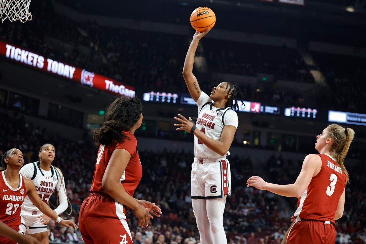 South Carolina’s Ashlyn Watkins (2) shoots as Alabama’s Essence Cody (21) and Sarah Ashlee Barker (3) defend during the first half of action in the Colonial Life Arena on Thursday, Feb. 22, 2024
