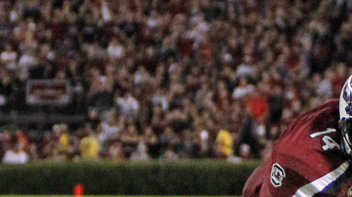 South Carolina Gamecocks quarterback Connor Shaw (14) dives into the end zone for a fourth quarter touchdown during their game against Georgia at Williams-Brice Stadium in Columbia, SC.