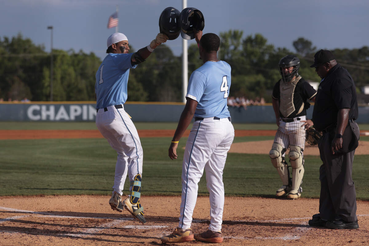 Chapin's Felix Flecha Ruiz (1) celebrates a home run with Chapin's Kaedyn Harris (4) during game 2 of the SC High School League Class 5A Division II baseball championship series on May 28, 2026, at Chapin High School. Chapin outscored TL Hanna 4-3 to win the state championship.