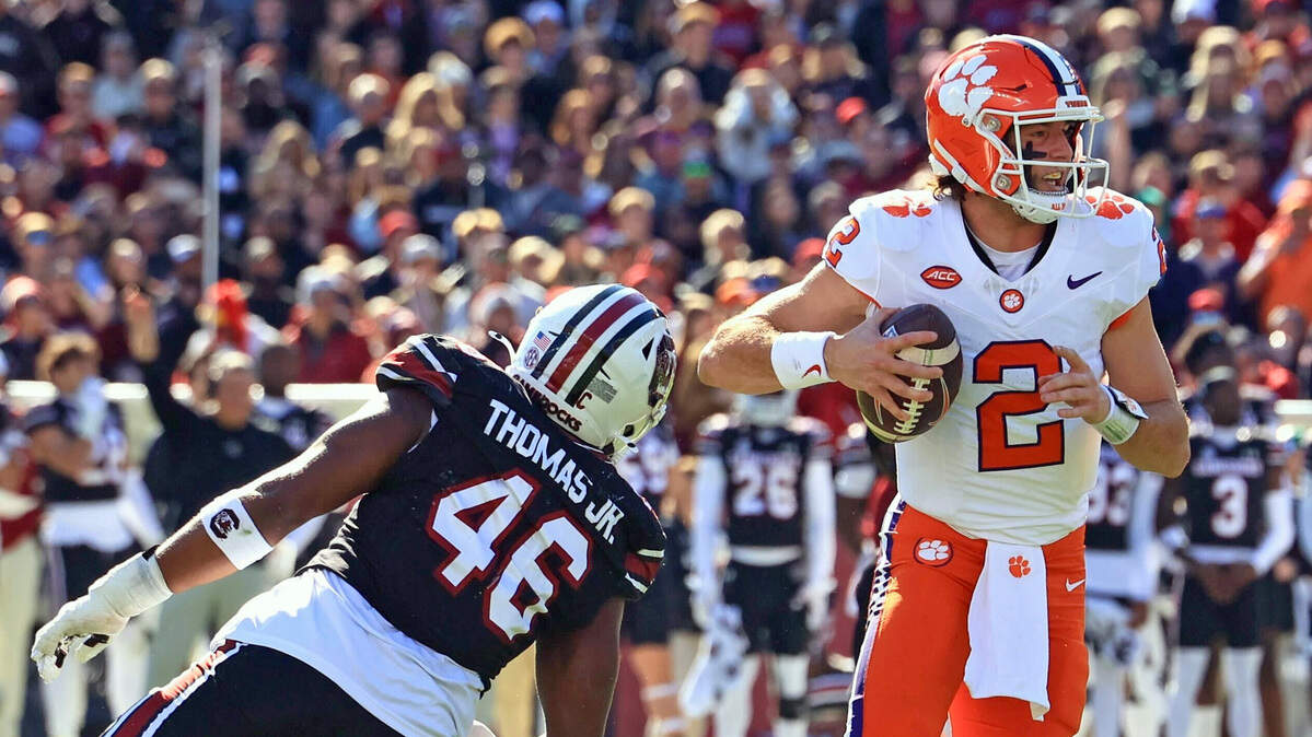 South Carolina’s Bryan Thomas Jr. knocks the ball out of Clemson QB Cade Klubnik’s hands, but Klubnik recovered and ran it in for a touchdown.
