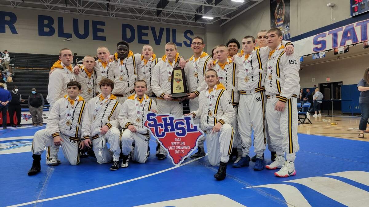 Eastside wrestling team poses with the championship trophy after defeating May River for the 2022 Class 4A championship on Saturday, Feb. 12, 2022.