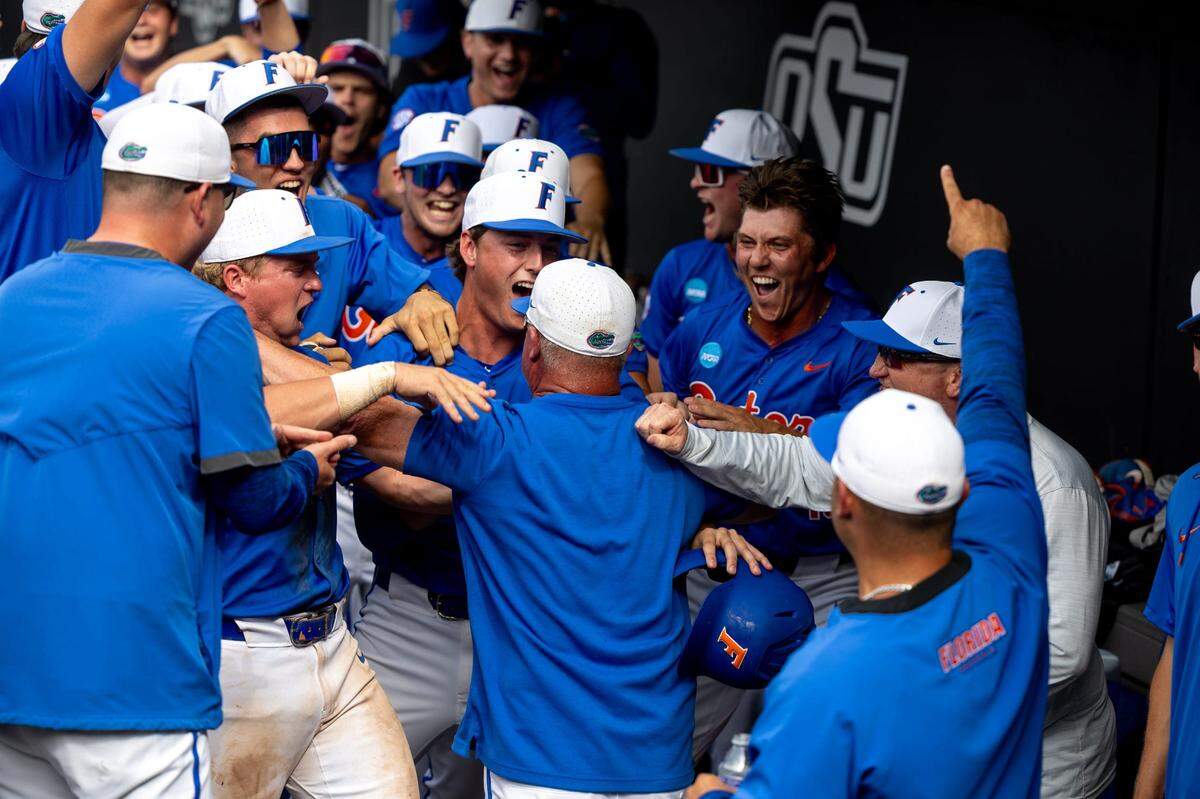 Jun 3, 2024; Stillwater, OK, USA; The Florida dugout celebrates with Head Coach Kevin OÕSullivan after a NCAA regional baseball against Oklahoma State game at O’Brate Stadium.
