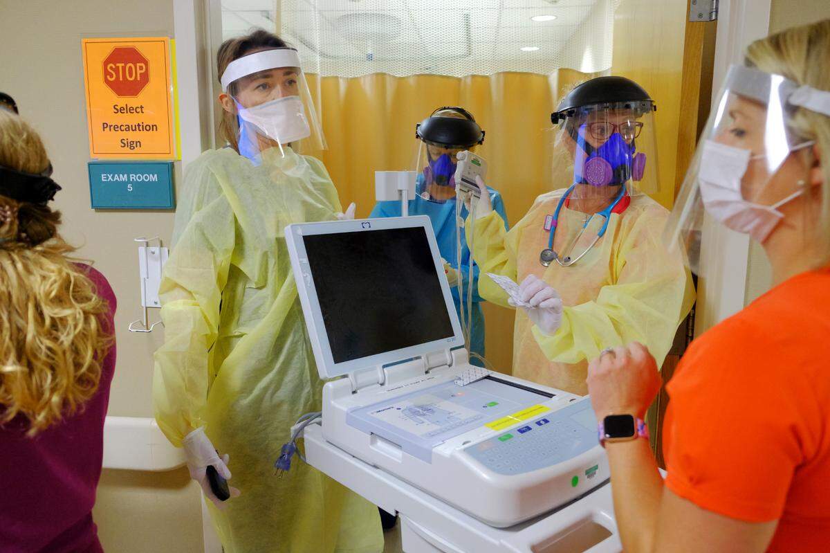 Emergency department employees at Lexington Medical Center wear their personal protective equipment as they prepare to work on a possible overdose patient, Tuesday, June 16, 2020. (Gerry Melendez/Lexington Medical Center)