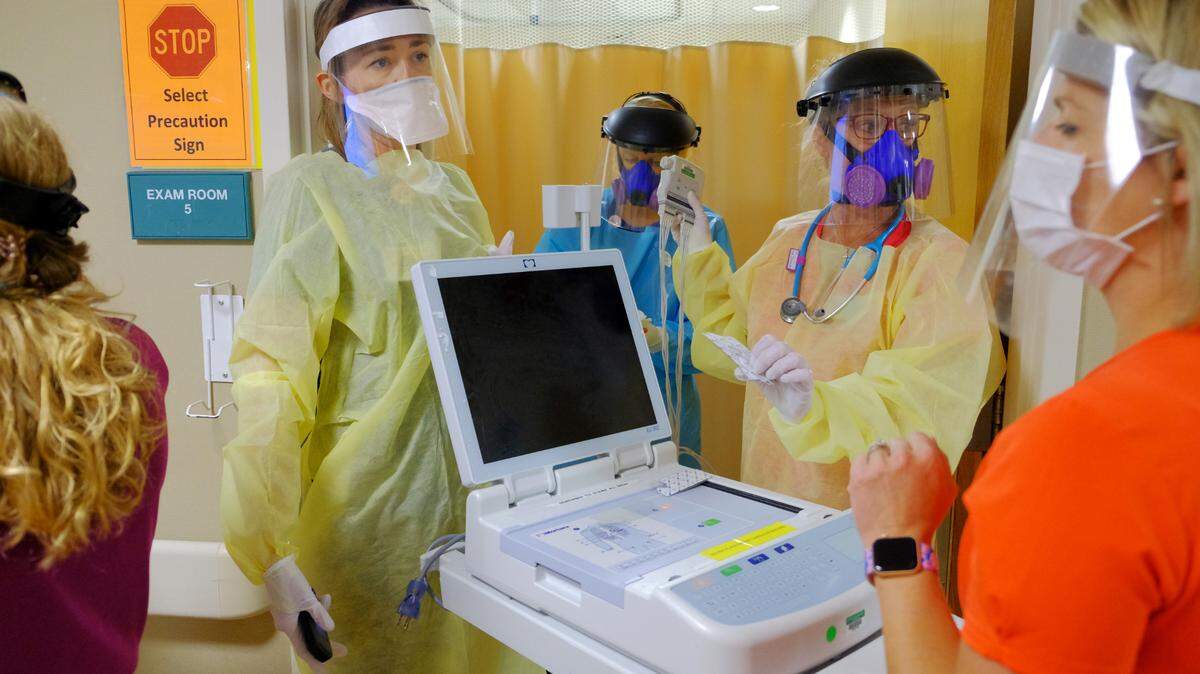 Emergency department employees at Lexington Medical Center wear their personal protective equipment as they prepare to work on a possible overdose patient, Tuesday, June 16, 2020. (Gerry Melendez/Lexington Medical Center)