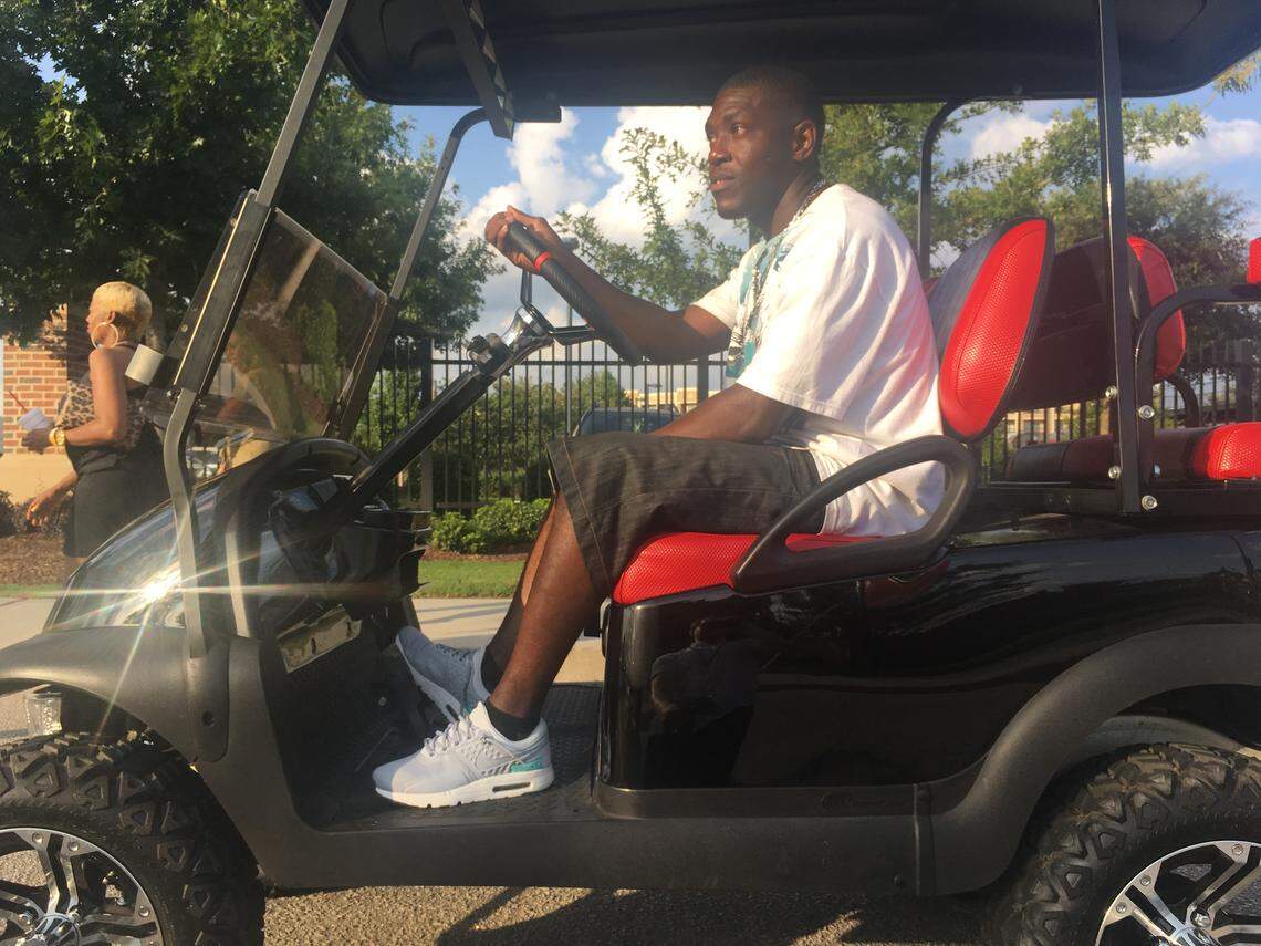 Thomas Jackson gave rides on his golf cart to concert goers at the Beyonce and Jay-Z On the Run II tour stop at Williams-Brice Stadium.