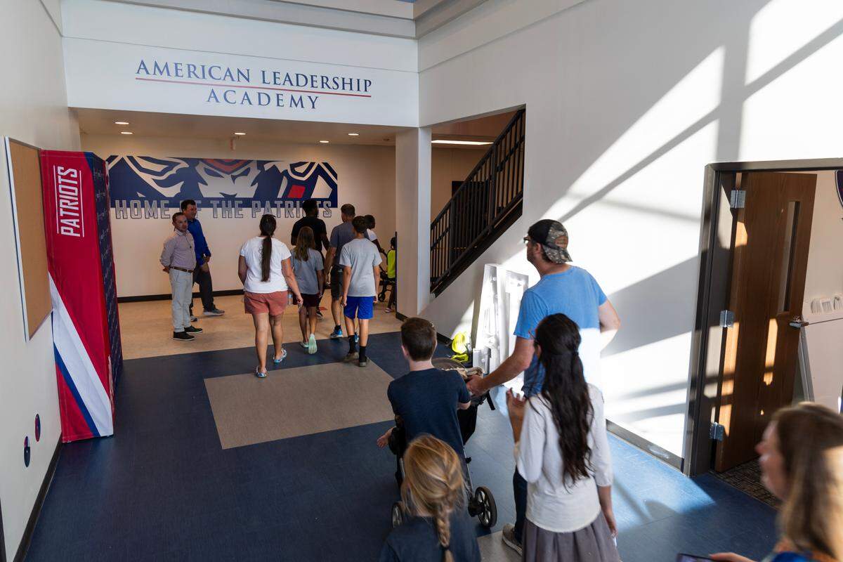 Families tour the American Leadership Academy Lexington upper school on Thursday, August 10, 2023. ALA Lexington is a traditional charter school authorized by the Charter Institute at Erskine that opened in August 2023.