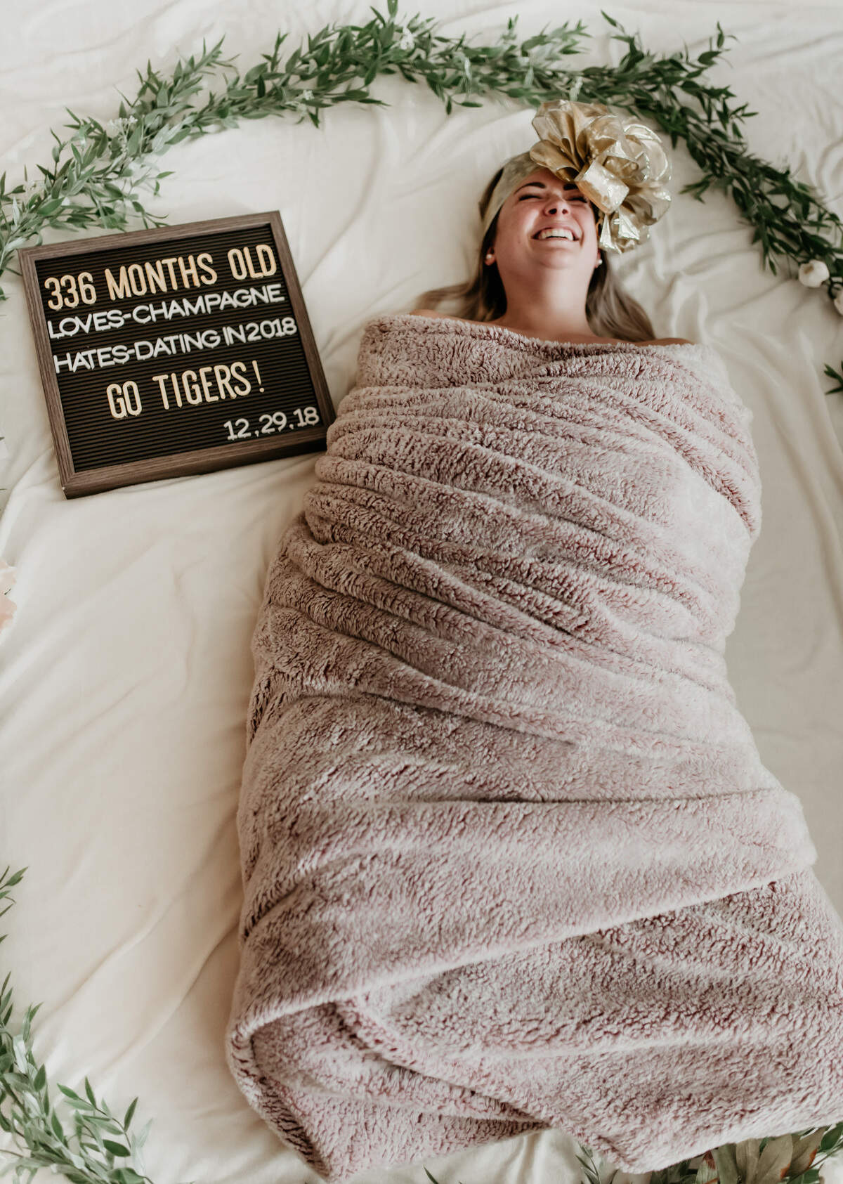 The photo session of Nicole Ham swaddled like a baby that was taken by her friend from Irmo High School Stephanie Smith has gone viral.