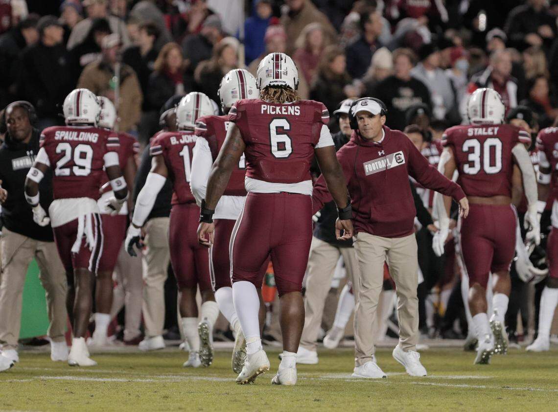 South Carolina’s head coach Shane Beamer congratulates defensive lineman Zacch Pickens (6) as the Gamecocks take on Florida on Saturday, Nov, 6, 2021 at Williams-Brice Stadium.