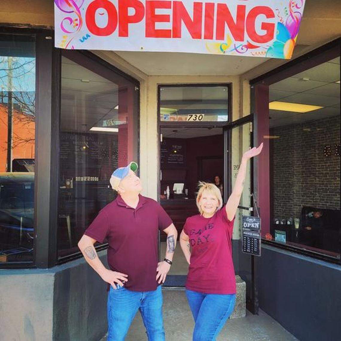 Amanda Murray, right, and Shawn Rhives, left, stand outside their new meal replacement shake business, Game Day Nutrition. The store has seen backlash because they use products from the company Herbalife Nutrition.