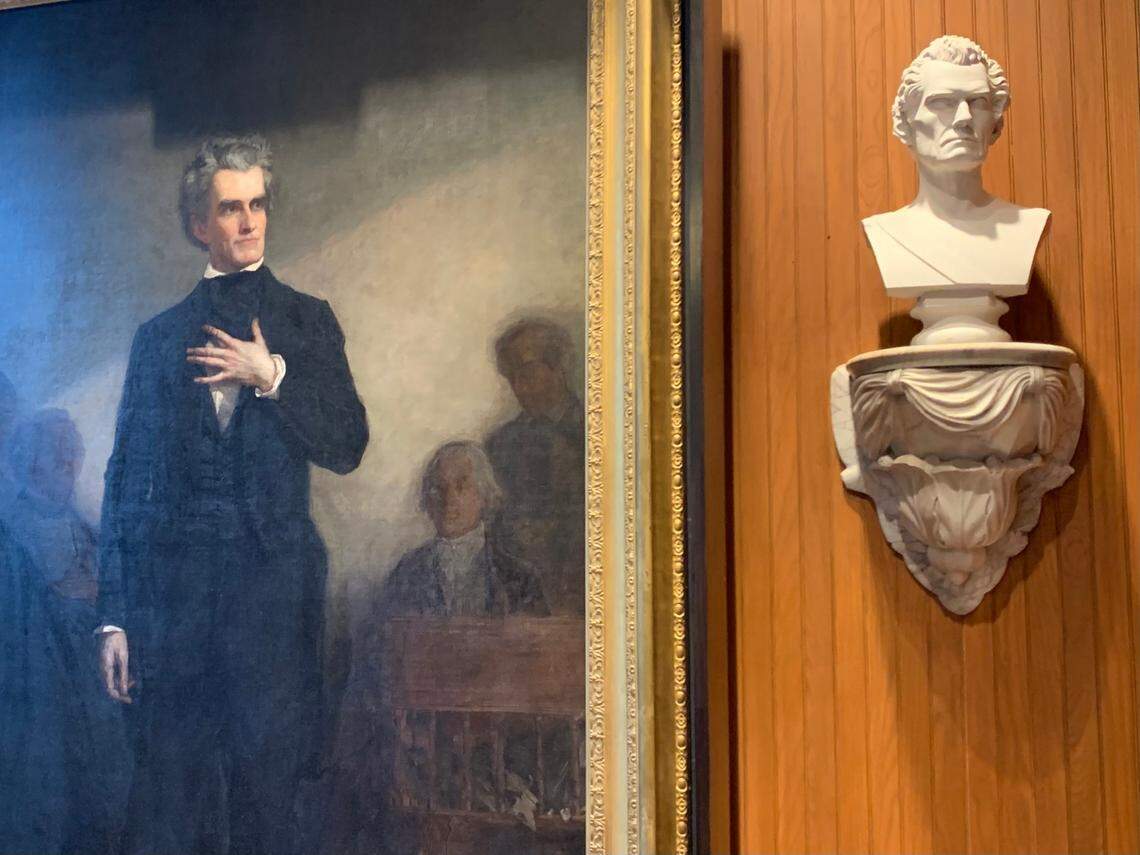In a room connected to Charleston City Council chambers, a life-size portrait of John C. Calhoun, left, looks at a bust of his own likeness. The portrait, which was commissioned by the city in 1850, depicts Calhoun’s last Senate speech. What was painted, though, never happened.