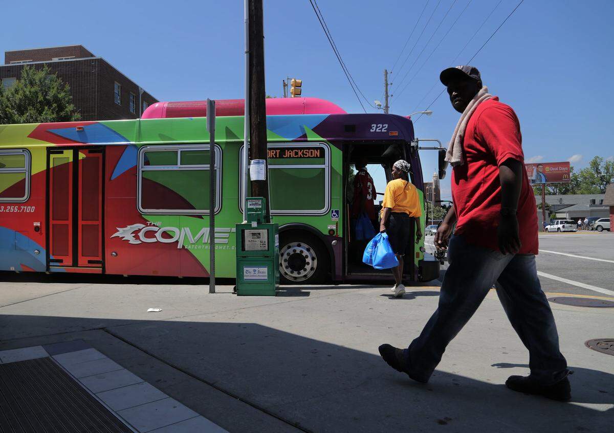 A bus arrives at the COMET Transit Center on Laurel Street in downtown Columbia.