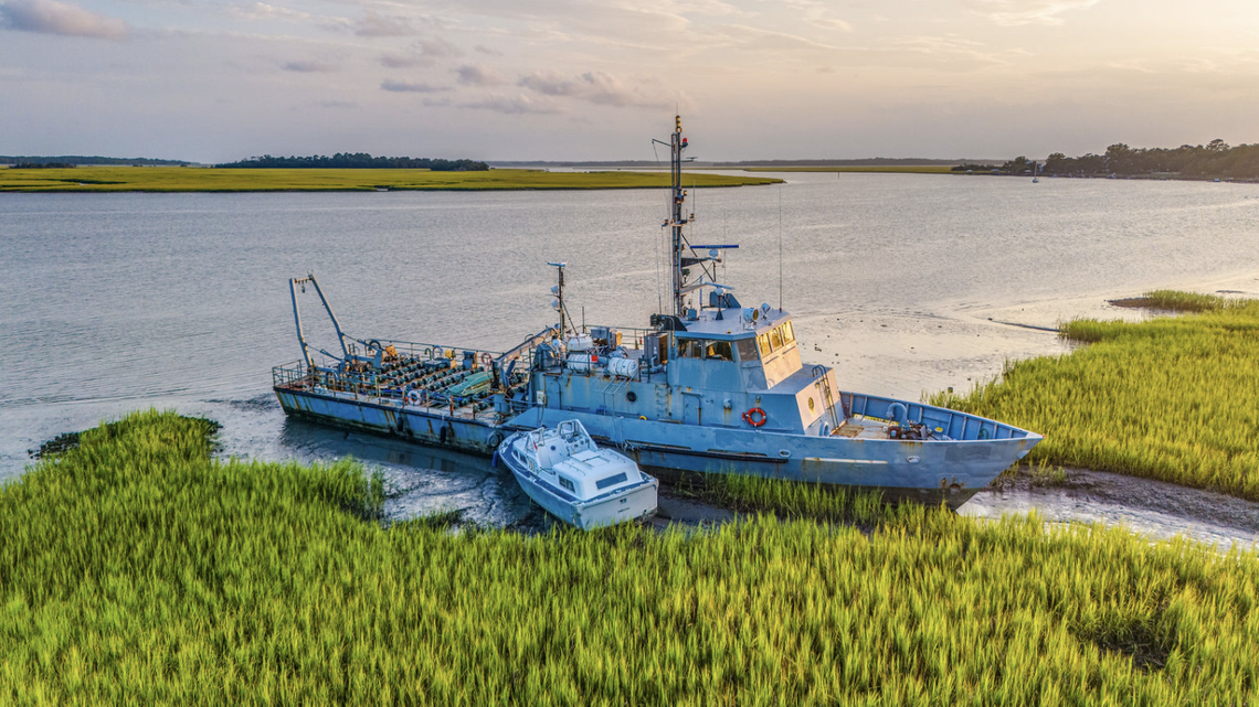 The owner purchased the Navy vessel then known as 120TR841 from the General Services Administration at a federal auction in March 2021 and it has been stuck in the Bohicket Creek for more than a year.