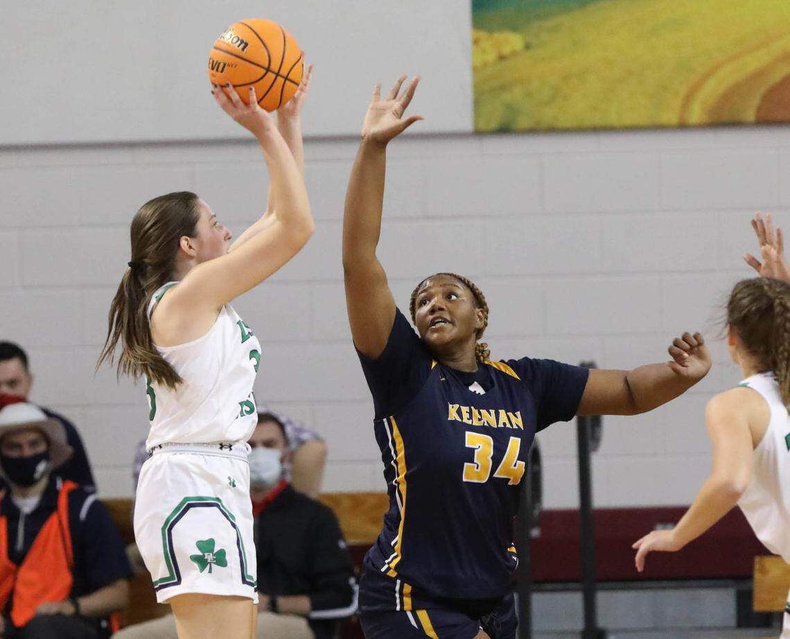 Bishop England’s Ella Schar (33) shoots as Keenan’s Samaya Johnson blocksduring the 3A state championship game at the USC Aiken Convocation Center on Friday, March 5, 2021.
