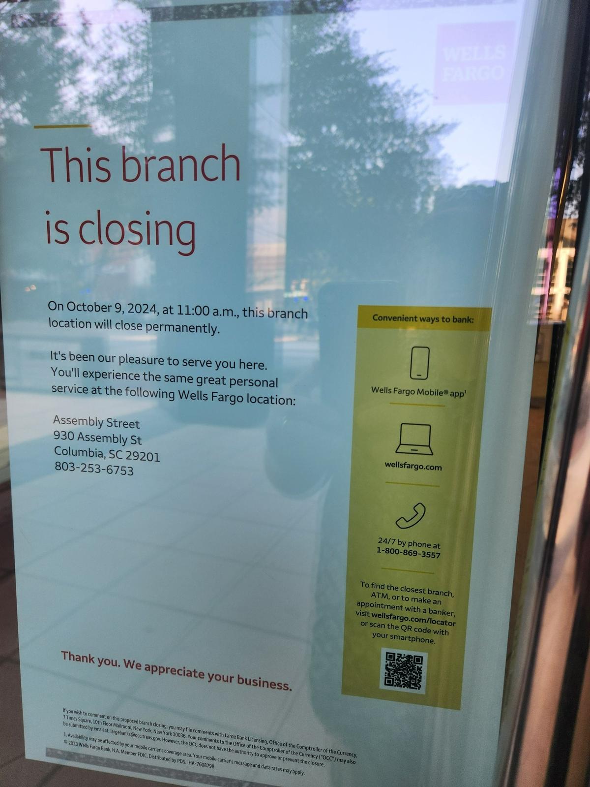 A sign on the door indicates the Wells Fargo branch at 1441 Main Street in Columbia is closing.