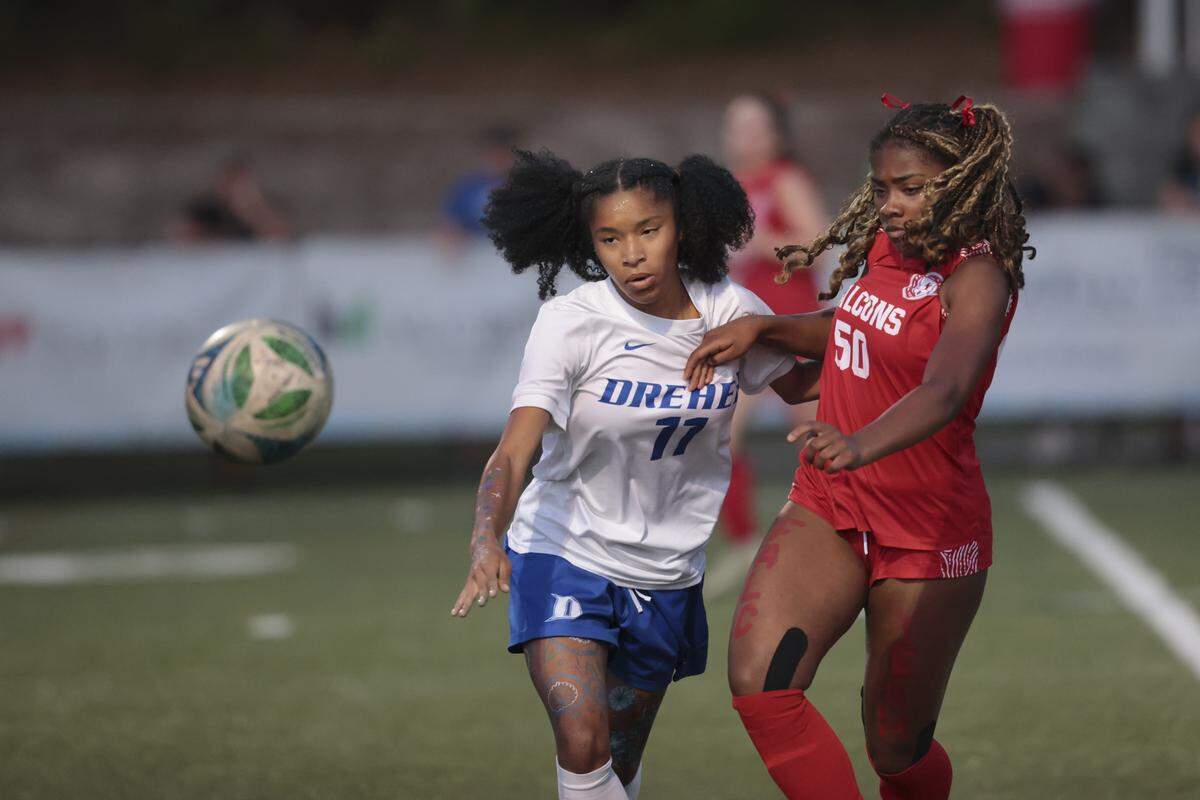 A.C. Flora's Zoe Merritt (50) and Dreher’s Karsyn Jackson (11) battle for the ball during the class 4A upper state playoffs on Friday, May 15, 2026 at A.C. Flora. Flora beat Dreher 1-0 to advance to the state championships.