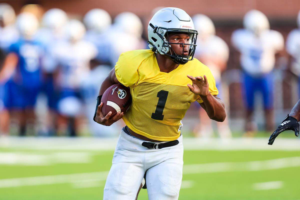Gray RB BJ Montgomery rushes during their three-team scrimmage at Dreher High School 8/12/24.