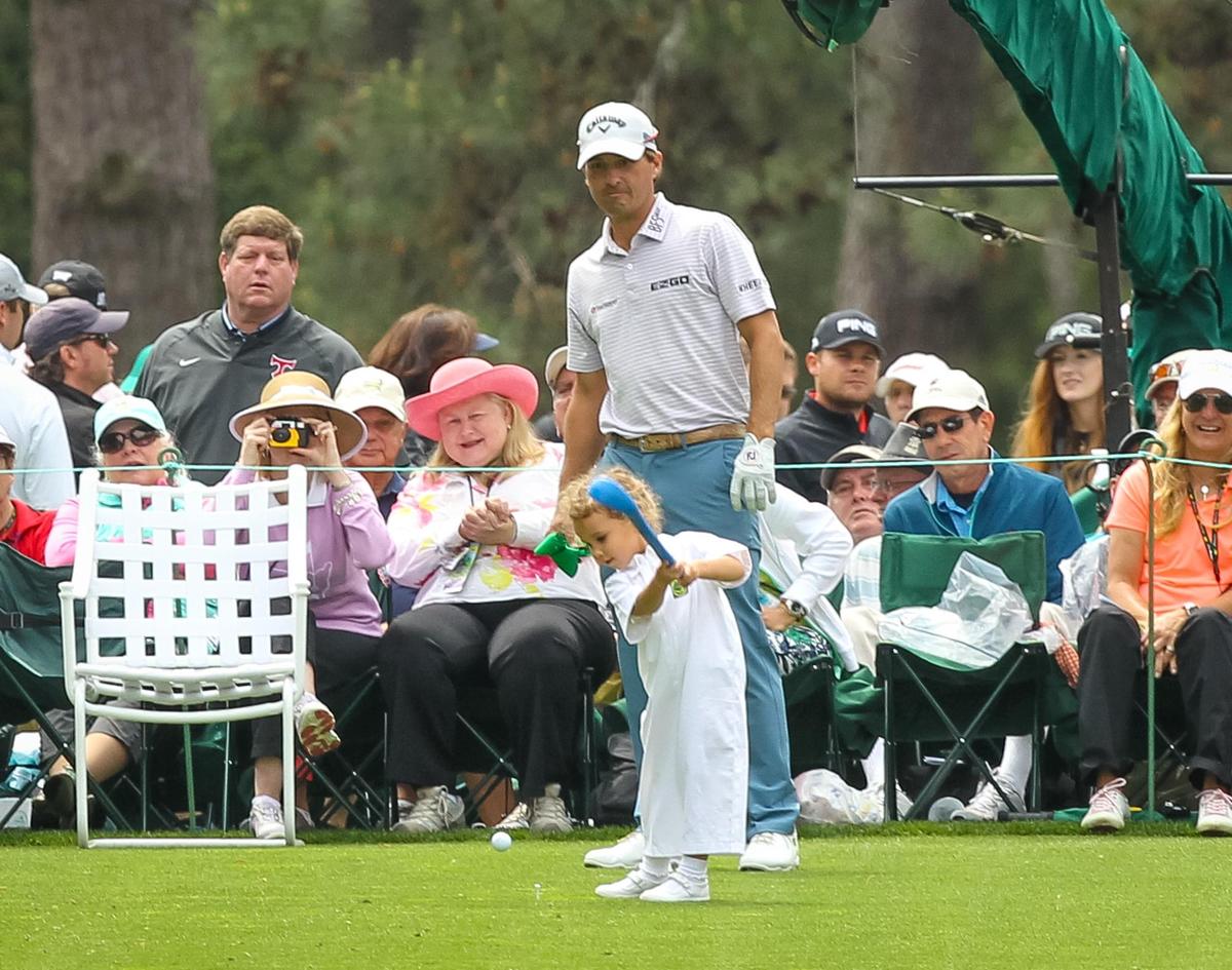 From 2018: Kevin Kisner watches his daughter drive off the first tee during the Masters Par 3 Tournament.
