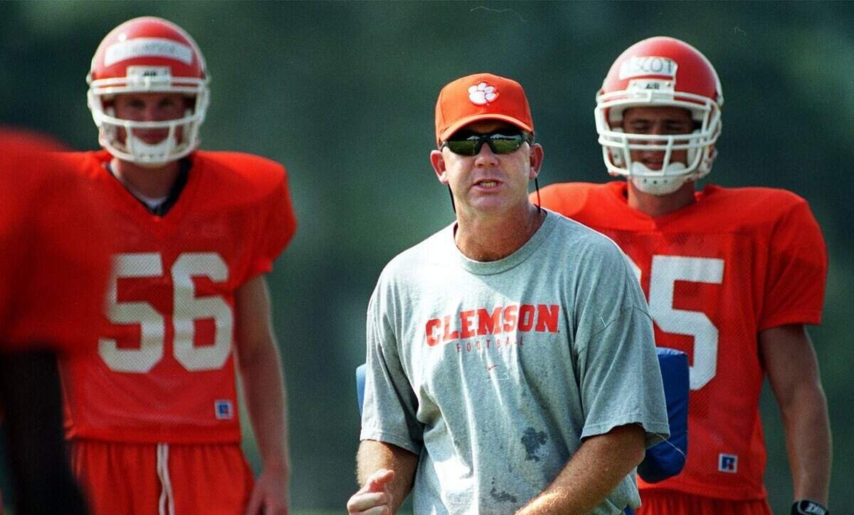Clemson Assistant Football Coach Rick Stockstill goes over tackling maneuvers with players at a practice on Aug. 8, 1999.