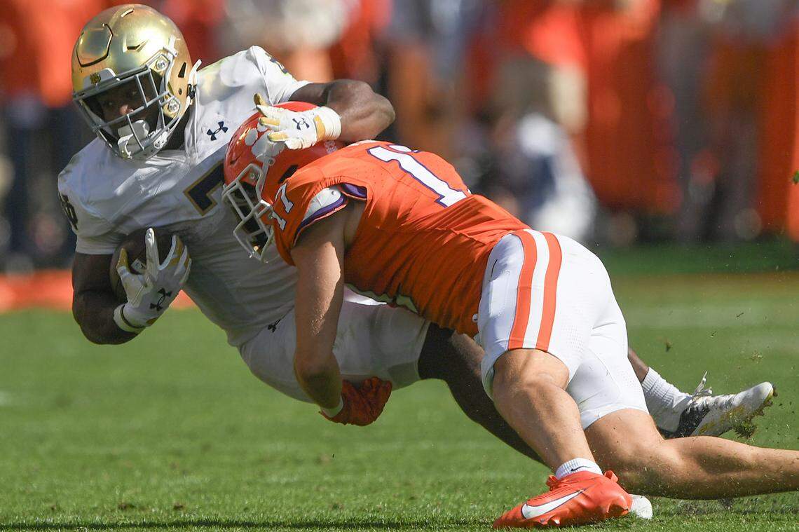Nov 4, 2023; Clemson, South Carolina, USA; Clemson Tigers linebacker Wade Woodaz (17) tackles Notre Dame Fighting Irish running back Audric Estime (7) during the second quarter at Memorial Stadium. Mandatory Credit: Ken Ruinard-USA TODAY Sports