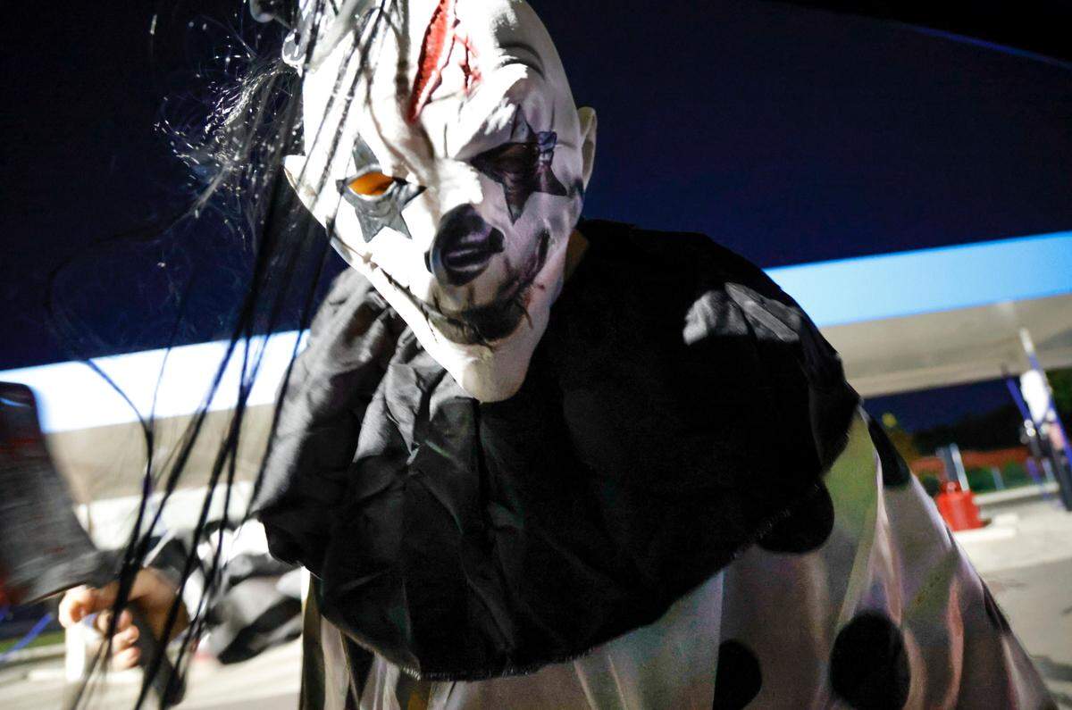 A scary ghoul peers into a car during the Haunted car wash experience at the Hurricane Express Wash. The car washes are offering a haunted car wash experience through Halloween.