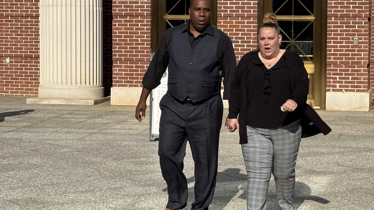 Samuel Gray (left), 53, of Lexington County, leaves federal court in Columbia on Wednesday, Nov. 19, 2025, after being sentenced to prison on dog fighting charges. 