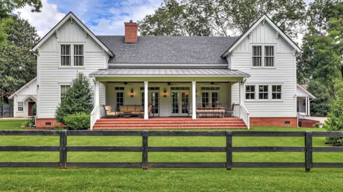 The two-acre lot in historic Aiken, SC, includes a 4,000-square-foot home and 16-stall stable.
