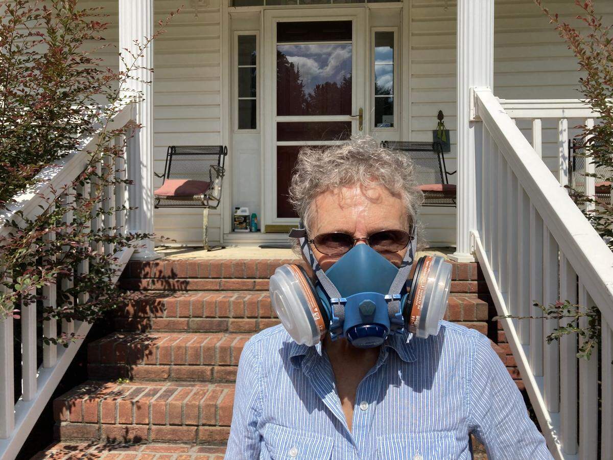 York County, SC resident Betty Rankin says she sometimes wears a gas mask to protect herself from fumes released by a paper mill nearby. (Sept. 14, 2022)