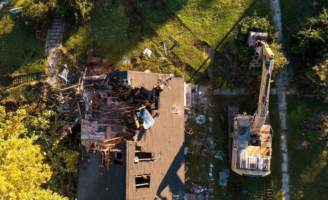 Crews demolish Allen Benedict Court Tuesday morning. The housing complex was built in 1940.