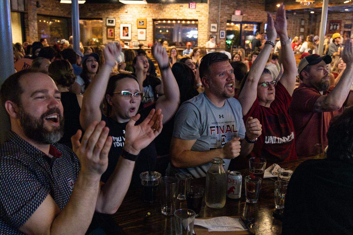 South Carolina fans celebrate the university’s women’s basketball team defeating Texas at Home Team Barbecue on Friday, April 4, 2025.