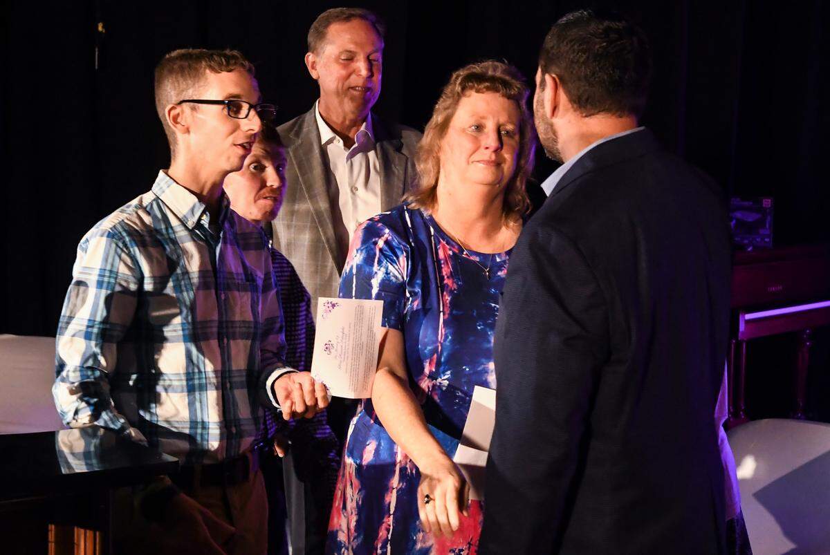 Virginia “Ginger” Harriott Hadwin, second from right, sister of the later Gloria Satterfield, thanks Rev. Brian Hunter for his prayer and remarks after the Harriott-Satterfield family announced on Thursday, June 16, 2022, a foundation called “Gloria’s Gift” as Gloria’s sons stand beside her. The foundation will help families in Hampton County who are in a financial bind during the Christmas season.