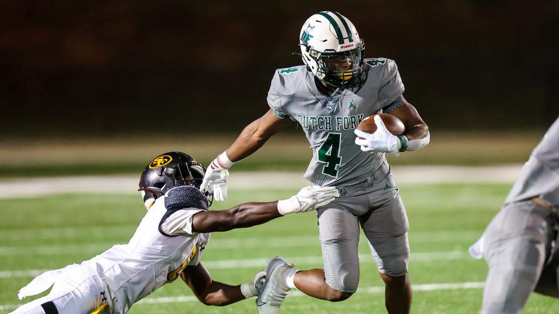 Dutch Fork Silver Foxes running back Jarvis Green (4) rushes against St. Frances during their game at Dutch Fork High School 9/23/22.