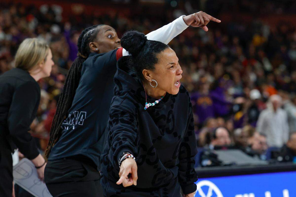University of South Carolina Head Coach Dawn Staley and Assistant Coach Khadijah Sessions get the attention of players during the second half of action against LSU in the SEC Tournament Championship game at Bon Secours Wellness Arena in Greenville on Sunday, Mar. 10, 2024.
