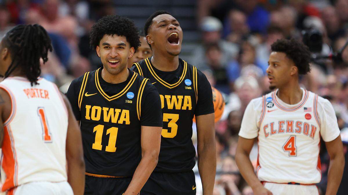 Kael Combs (11) and Cam Manyawu (3) of the Iowa Hawkeyes react against the Clemson Tigers during the first half in the first round of the 2026 NCAA Men's Basketball Tournament at Benchmark International Arena on March 20, 2026 in Tampa, Florida. (Photo by Mike Carlson/Getty Images)
