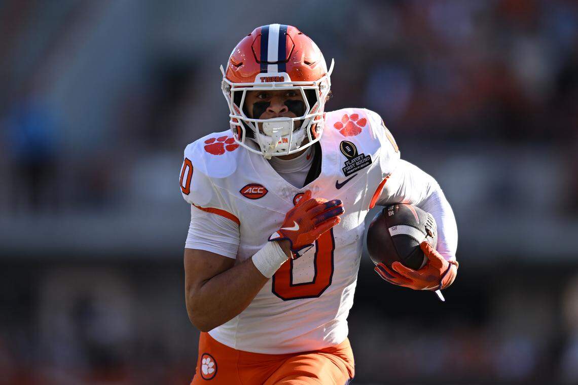 Antonio Williams #0 of the Clemson Tigers runs the ball after a catch for a touchdown during the first quarter against the Texas Longhorns in the Playoff First Round Game at Darrell K Royal-Texas Memorial Stadium on December 21, 2024 in Austin, Texas.