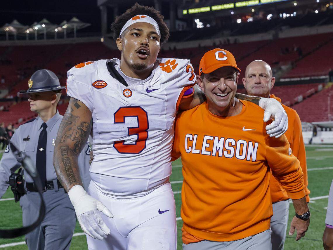 Clemson defensive end T.J. Parker (3) with head coach Dabo Swinney