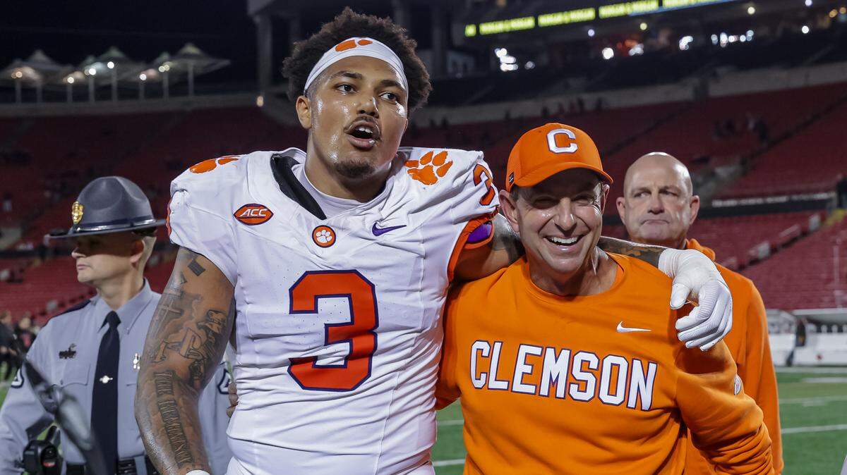 LOUISVILLE, KENTUCKY - NOVEMBER 14: T.J. Parker #3 of the Clemson Tigers celebrates with head coach Dabo Swinney of the Clemson Tigers after the NCAA football game between the Louisville Cardinals and the Clemson Tigers at L&N Federal Credit Union Stadium on November 14, 2025 in Louisville, Kentucky. (Photo by Michael Hickey/Getty Images)