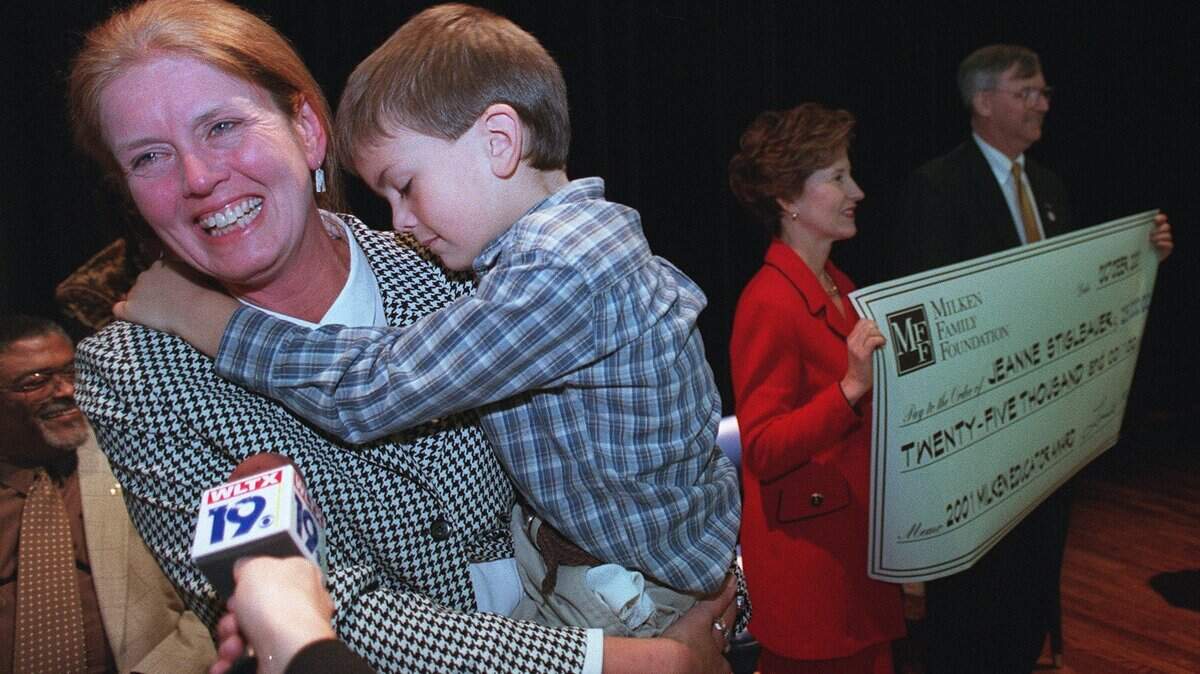 Dreher principal, Jeanne Stiglbauer holds her son Grayson as she speaks with media after receiving the Milken Foundation teaching award for $25,000 in 2008. Director of the S.C. Associaiton of School Administration, Robert Scarborough and State Superintendent of Education, Inez Tenenbaum can be seen in the background holding the check for $25,000.