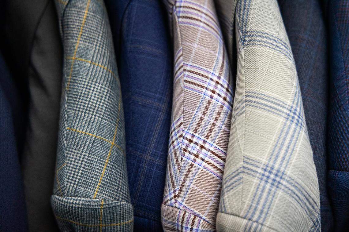 Suits in traditional and bold patterns for sale at Looking Good on Two Notch Road on Thursday, September 4, 2025.