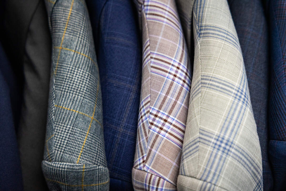 Suits in traditional and bold patterns for sale at Looking Good on Two Notch Road on Thursday, September 4, 2025.