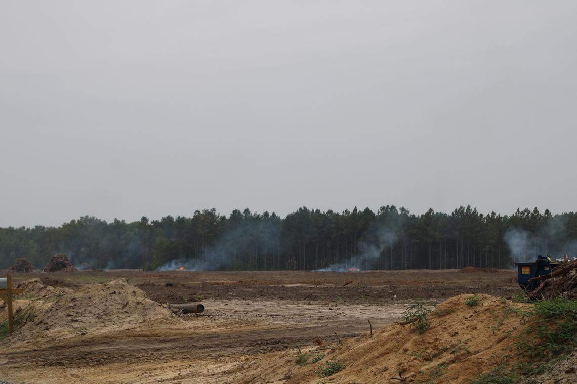 Piles of trees litter that landscape after being cut to make room for a new electric vehicle plant in Blythewood, SC.