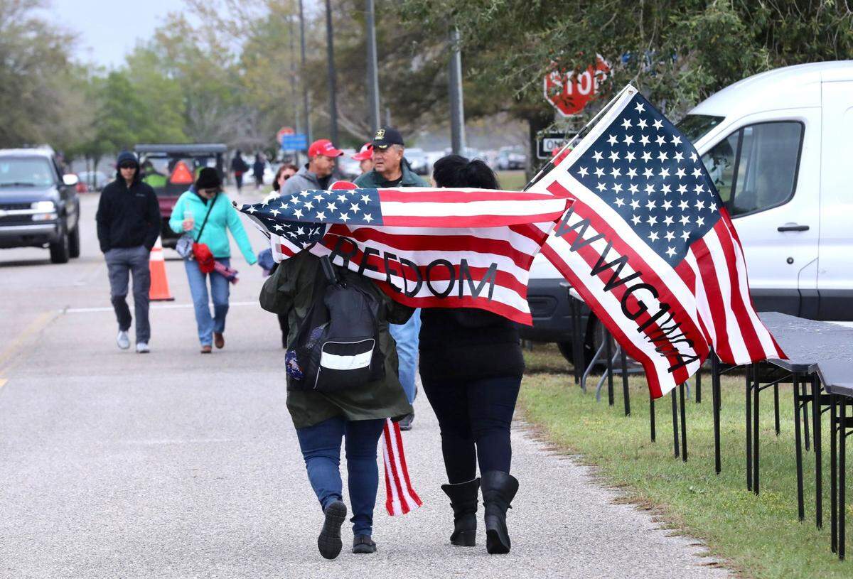 Supporters gather hours ahead of former President Donald Trump’s rally in Florence, S.C., on Saturday, March 12, 2022.