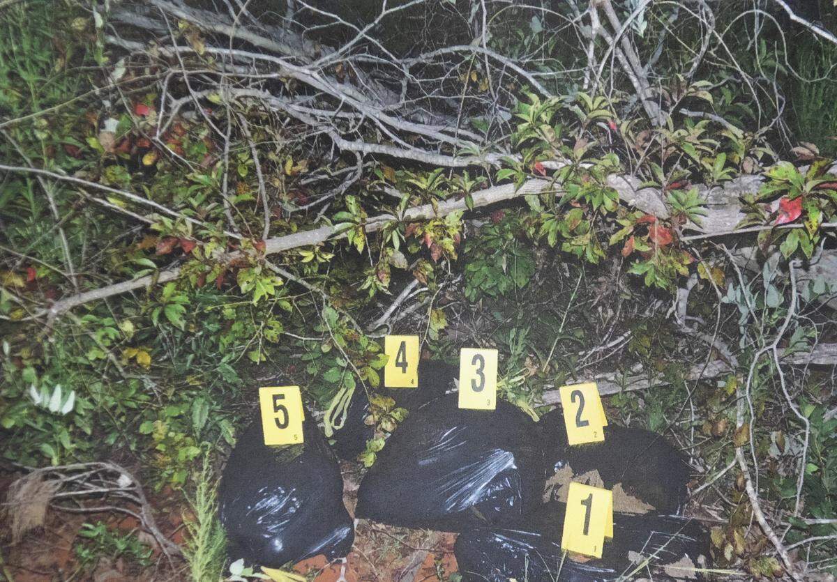 This photograph, entered into evidence, shows the five black garbage bags containing the bodies of Tim Jones’ children. 5/16/19